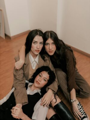 Group of Woman Friends Sitting and Lying Together on Floor
