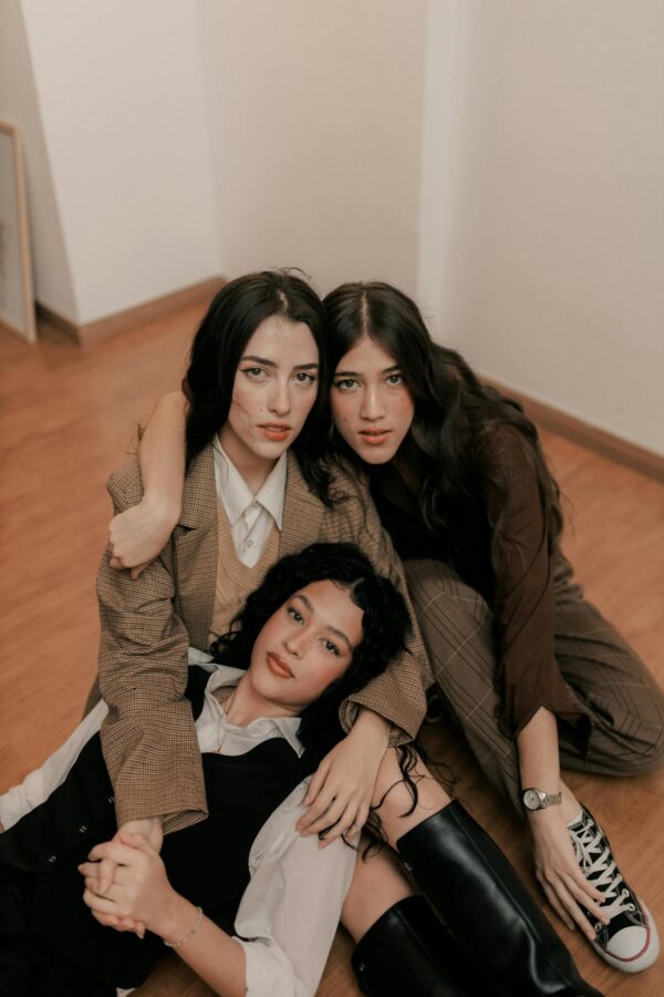 Group of Woman Friends Sitting and Lying Together on Floor