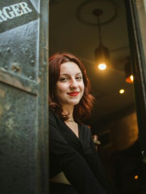 Smiling Woman in Door